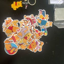 new winnie the pooh keychain and 50 stickers 
