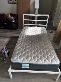 Twin bed frame with mattress for sale