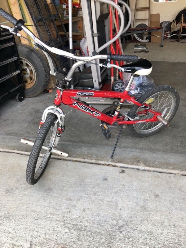 Red Next Bike with pegs