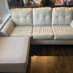 Cream Pleather Couch With Fabric Ottoman 