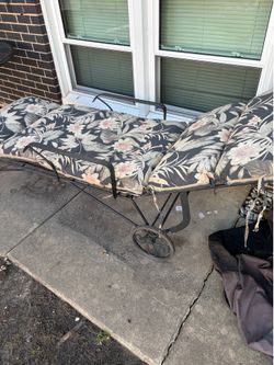 Wrought iron chaise.