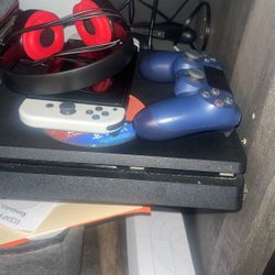 PS4 With 2 Remotes And Games