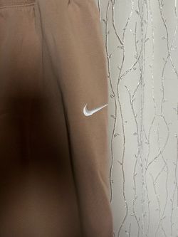 Beige Nike sweats.