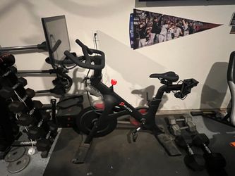 Peloton bike + 2 pairs of shoes + bike mat