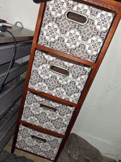 Wooden dresser with four fabric drawers
