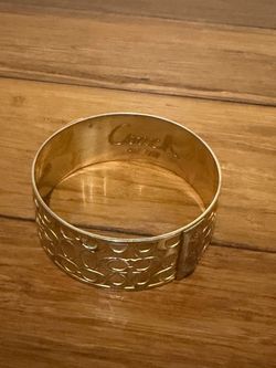 Coach Gold-Tone Signature Bangle Bracelet