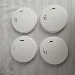 4 First Alert Smoke Detectors.