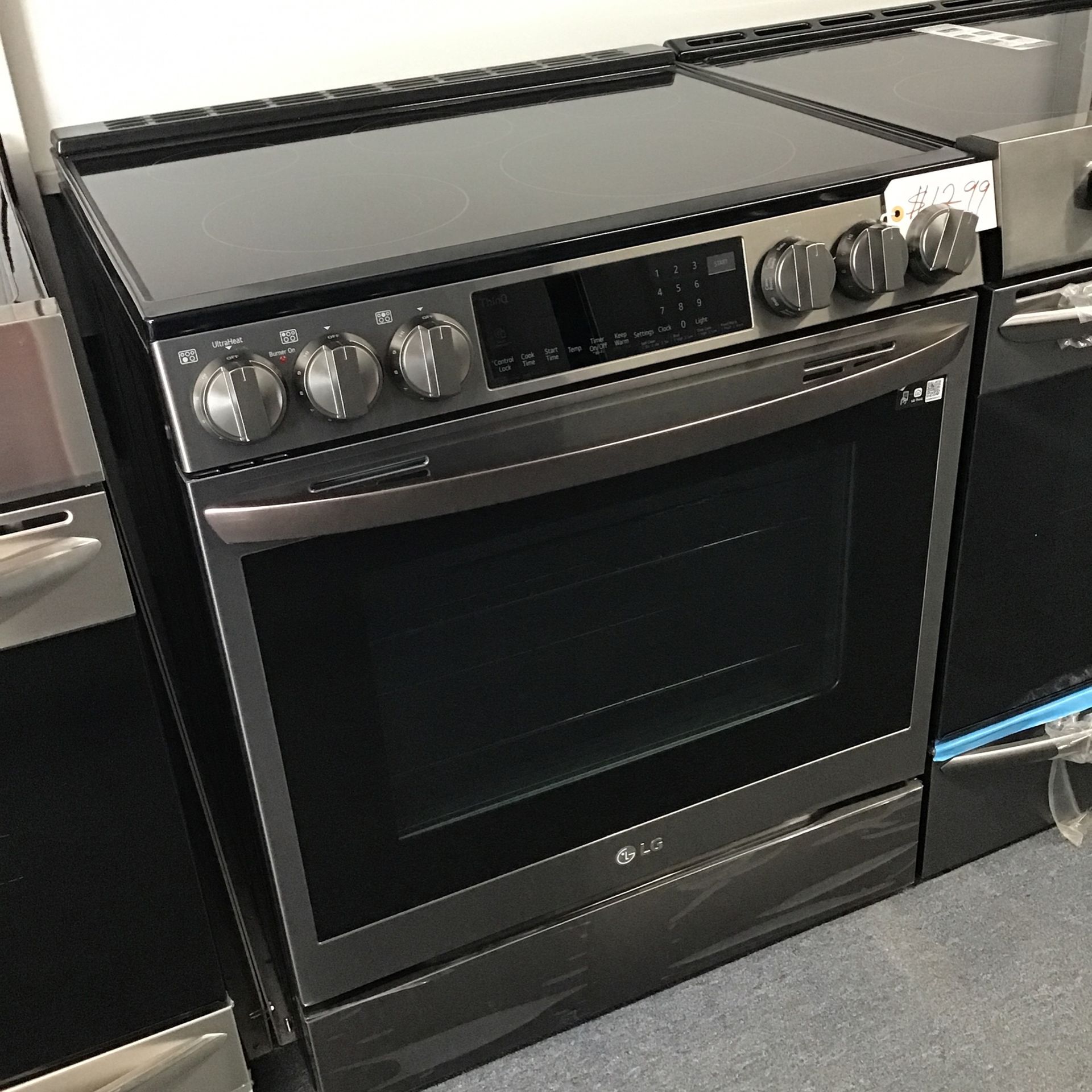 New Scratch And Dent LG 5 Burner Glass Top Black Stainless Steel Slide In Range. 1 Year Warranty