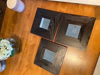 3 Small black wall mirrors