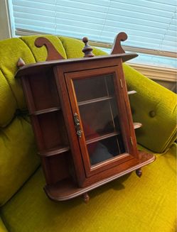 Wooden Curio Cabinet with glass door.