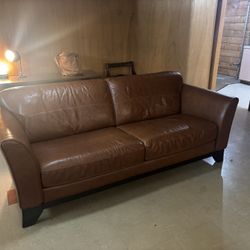 Pair Of Brown Leather Couches And Ottoman 