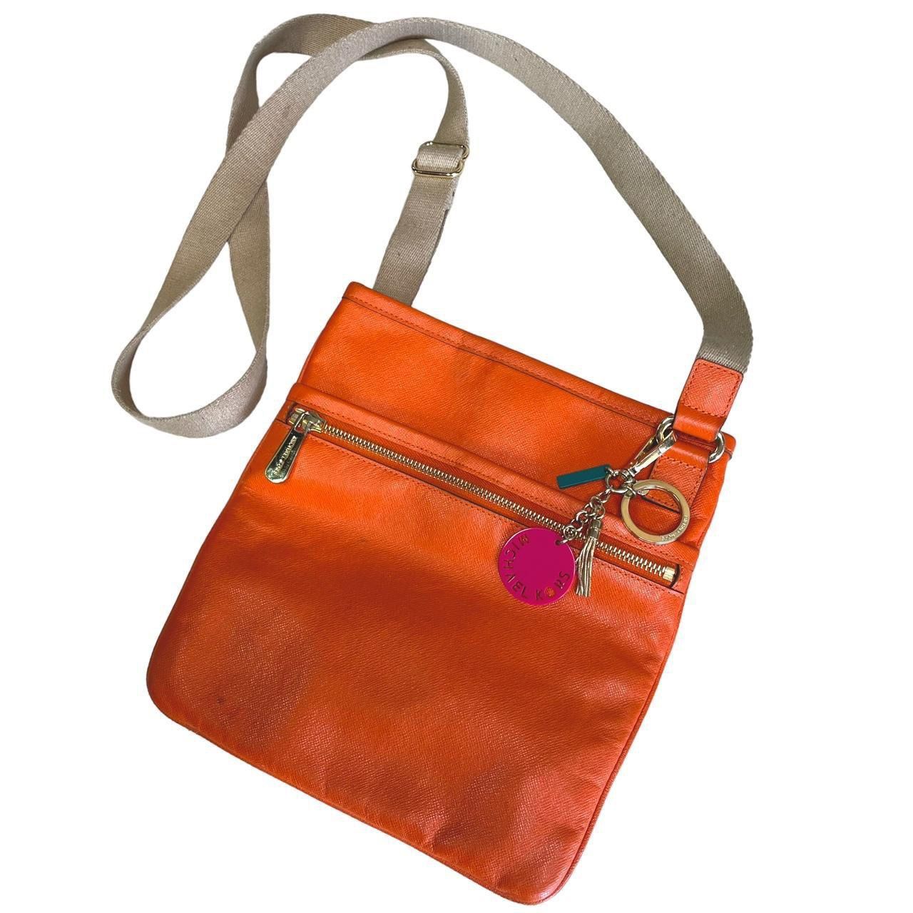 Michael Kors Orange Crossbody Bag and additional attached MK Key Chain Accessory