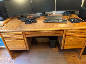 Solid wood oak desk with ball bearing metal sliders 60 inches long x 30” h x 32” d has key