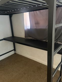 Bed frame with a desk