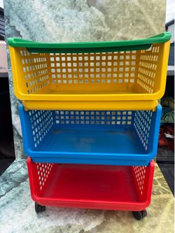 Multi Color Toy Storage Bin On Wheels .  18” wide  13” deep  27 1/4” tall