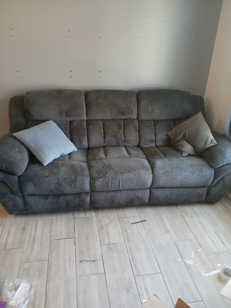 Olive Green / Gray dual recliner couch.