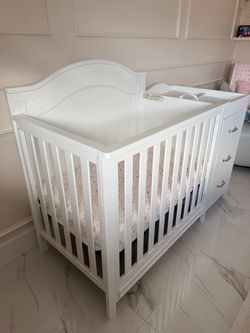 White Baby Crib with Attached Changing Table