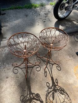 Pair of copper colored plant stands