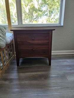 Brown wooden bedside table