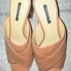 These are a pair of Lafayette 148 New York leather block heel mules. 