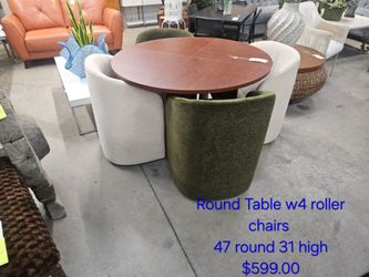 Round Dining Table with 4 Upholstered Roller Chairs We are located at 2811 East Bell road. Another Time Around Furniture.