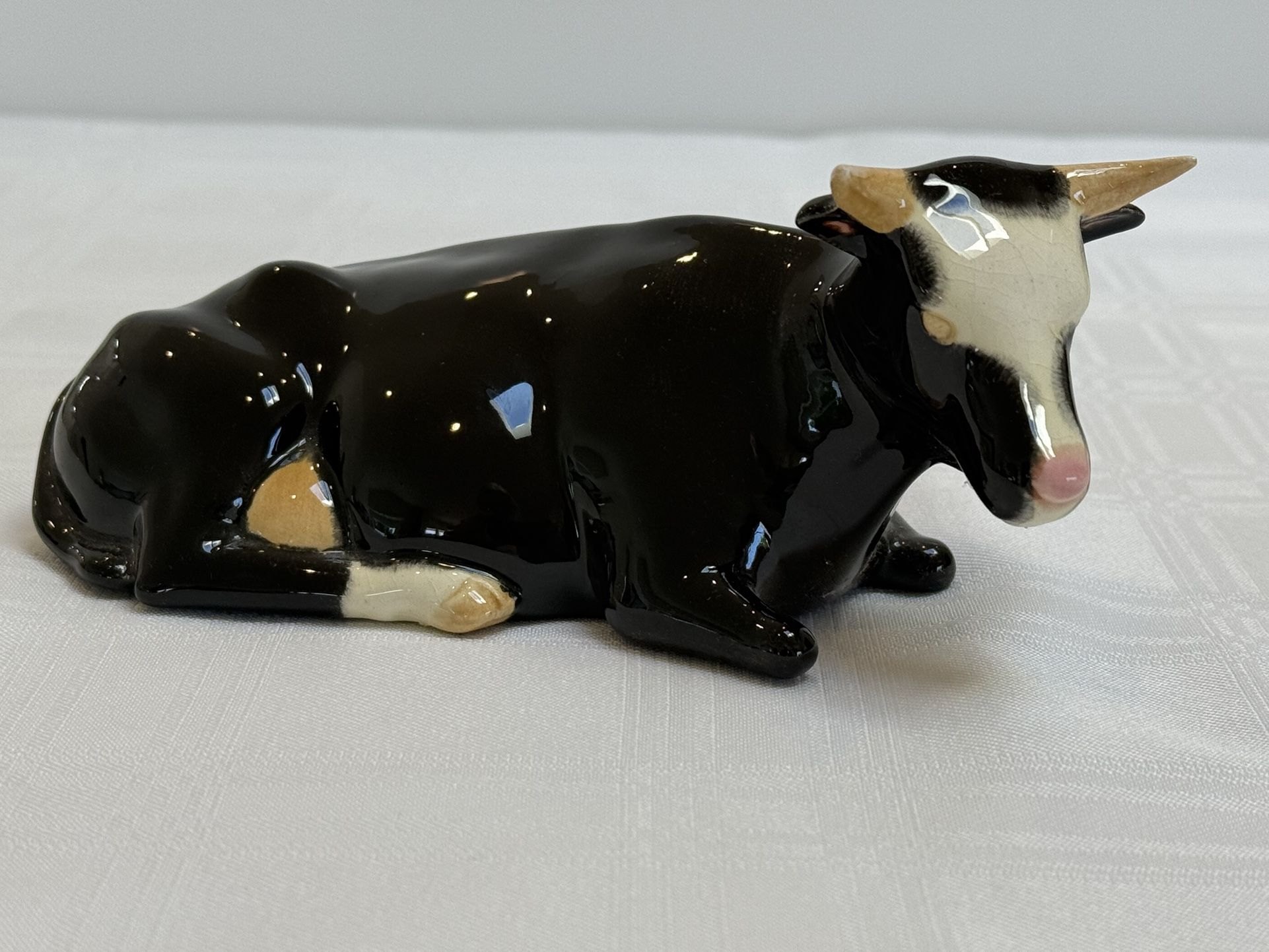 Vintage Porcelain Cow Figurine Resting Black & White Face | Collectible Cow Figurine