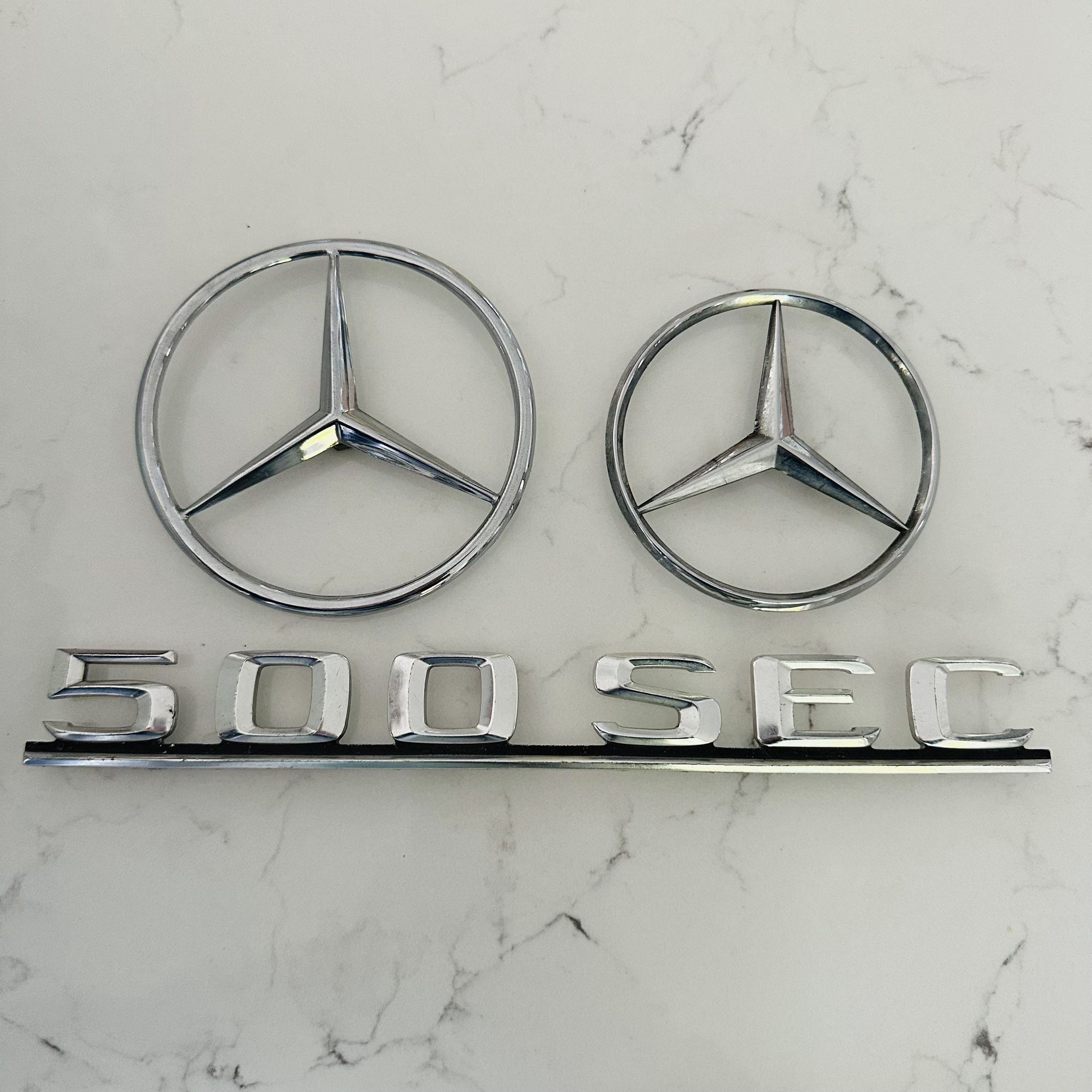 3 Piece Lot includes 1 Mercedes Benz 500 SEC Emblem Chrome Metal Logo OEM And 2 Round Logos