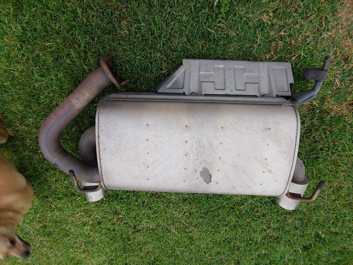 Nissan 350Z OEM muffler with chrome tips and a Borla resonator