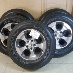 5 Bridgestone Dueler Tires with 18" Jeep Rims $600