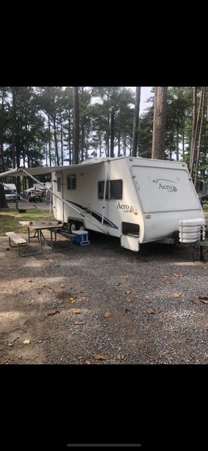 Photo Aero Cub 22’ camper with rear pop out.