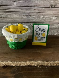 Miniature lemons and sign