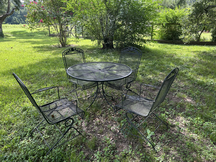 Vintage mesh-top wrought iron patio set with 4 rocking chairs $300