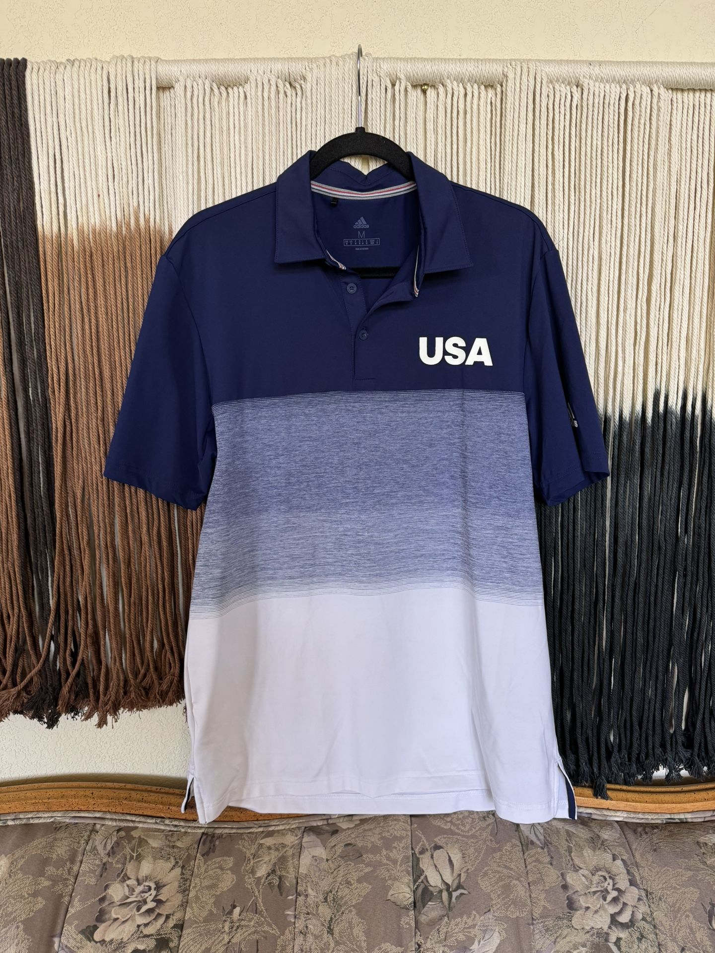 Blue and white Adidas USA polo with Kings River Golf & Country Club embroidered logo on the right arm and Adidas logo on the left arm