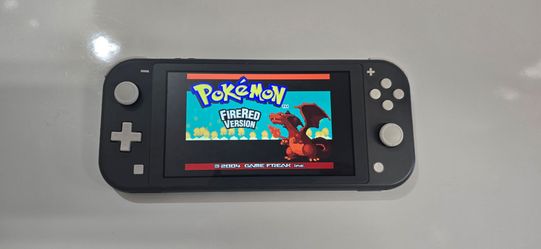Nintendo Switch lite in gray with Pokémon FireRed and Pokemon LeafGreen
