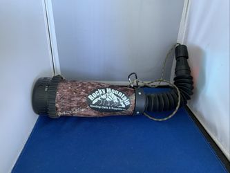 Rocky Mountain Hunting Calls elk bugle tube, designed to amplify and modulate bugle calls for hunting. Includes a camouflage fabric cover to reduce no