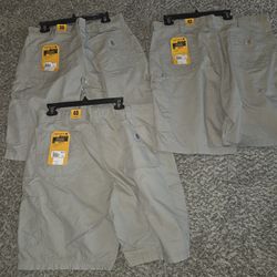 Carhartt Men's Canvas Work Shorts, available in various sizes 38, 40, & 42. (New)Tan
$20 each!