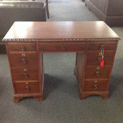 Vintage desk in cherry wood with rope design top and seven drawers