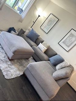 Grey sectional couch with ottoman