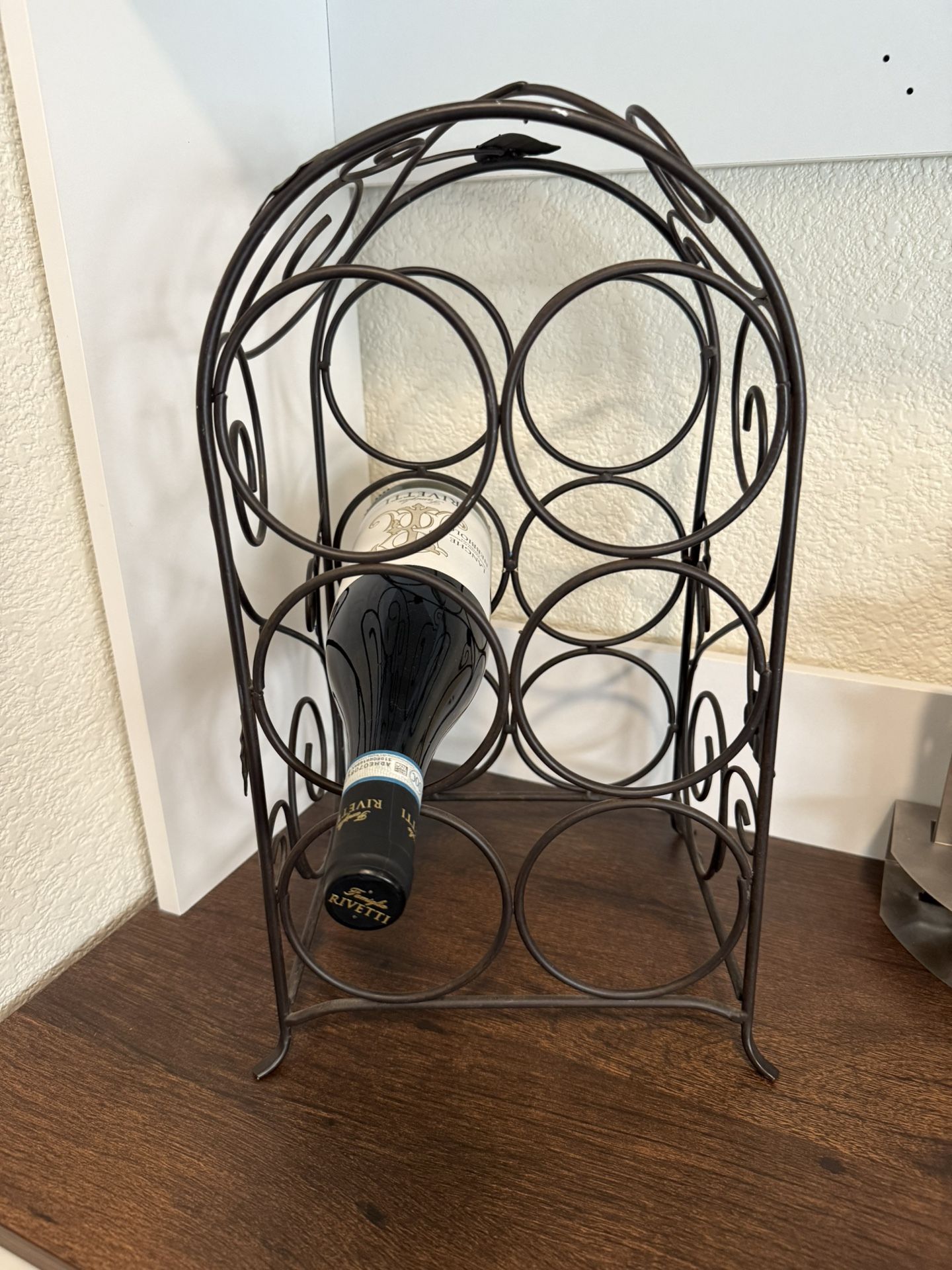 Wine rack with 6 openings for wine.