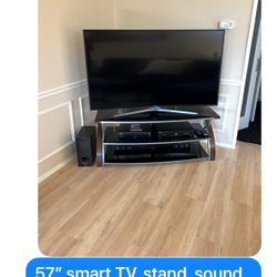 57” Smart TV With Stand And Soundbar And Speaker 