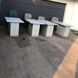I am selling these 4 filing cabinets with their respective desk pieces and secretarial chairs.