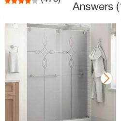 Brand New In Box Slideing Shower Doors Smoked Glass With Design In Glass A Cross Frameless Doors $225. Here In Store  $638.