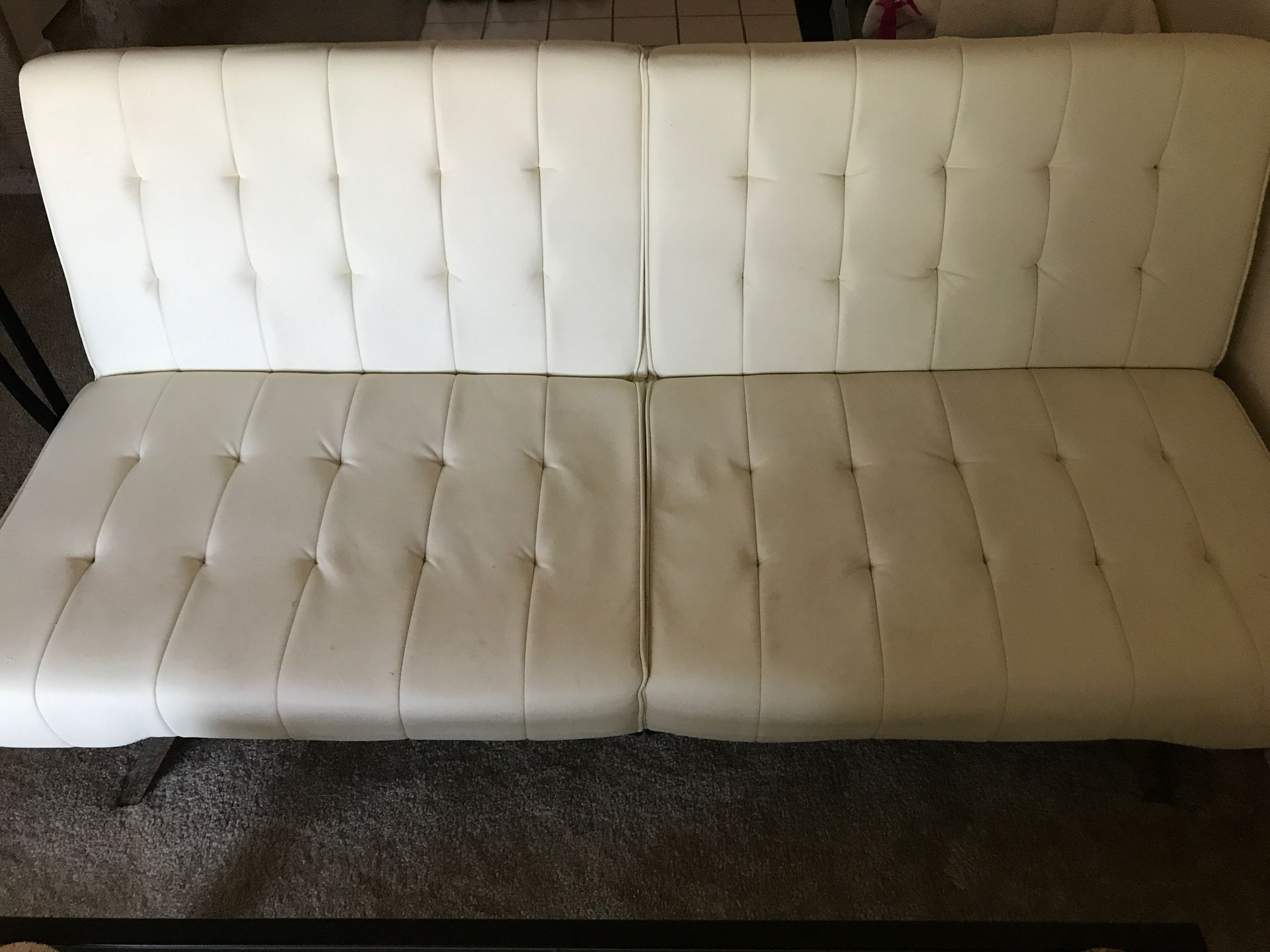 White faux leather folding futon full-size bed 12 x 35 x 44” when folded