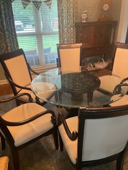 Round glass top table and chairs