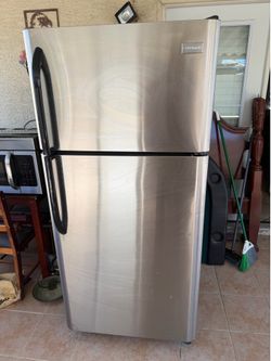 Frigidaire refrigerator, microwave and kitchen cabinets