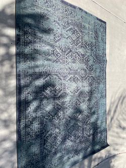 Blue distressed area rug