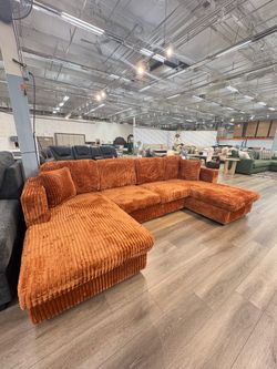 New burnt orange U-shaped corduroy sectional