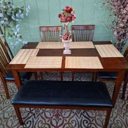 Beautiful Dining Table With A Bench And 4 Cushion Chairs 