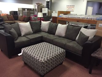 Grey sectional and ottoman