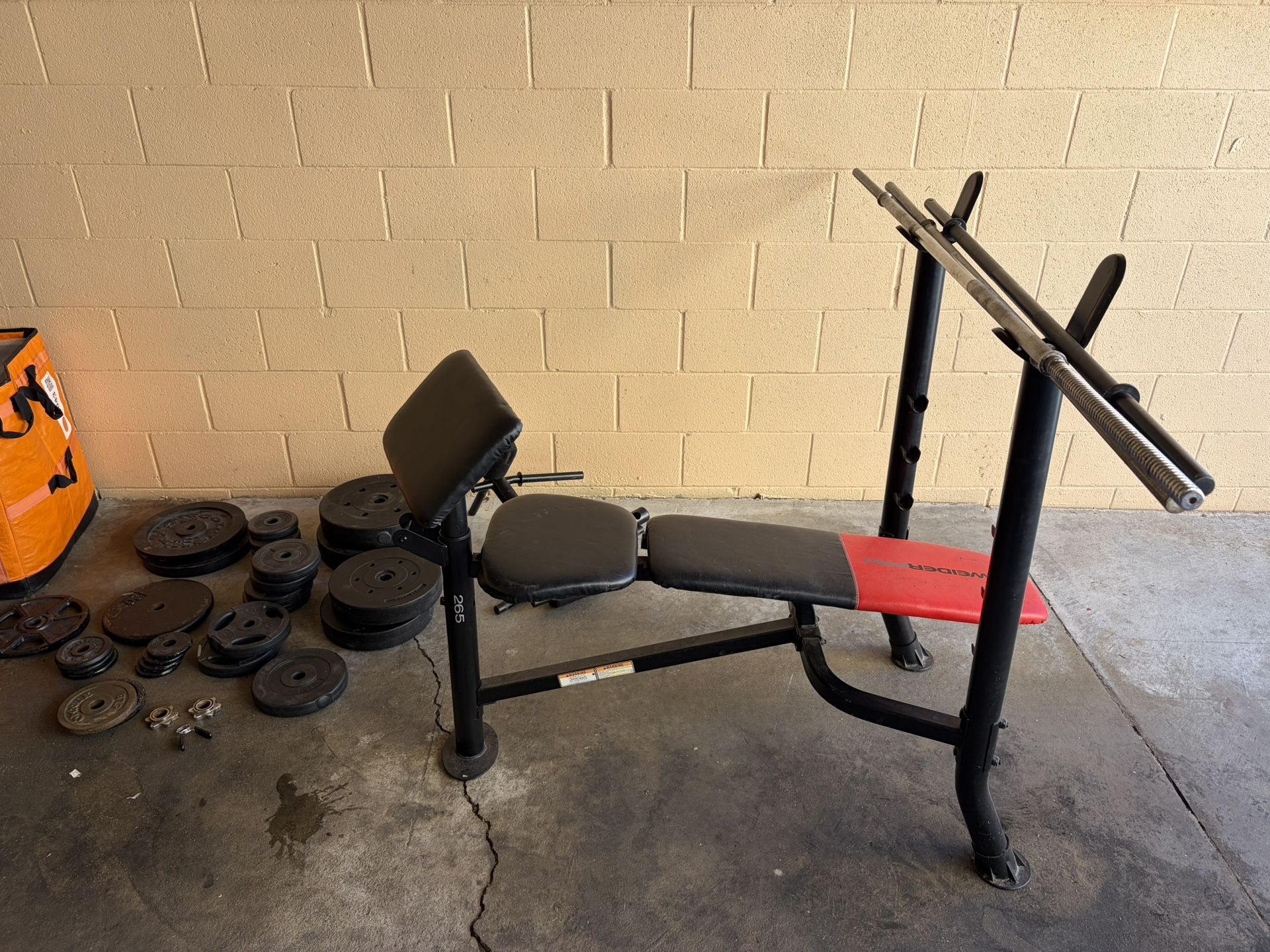 weight bench press with metal and concrete weights